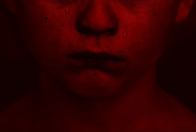Sad child red filter