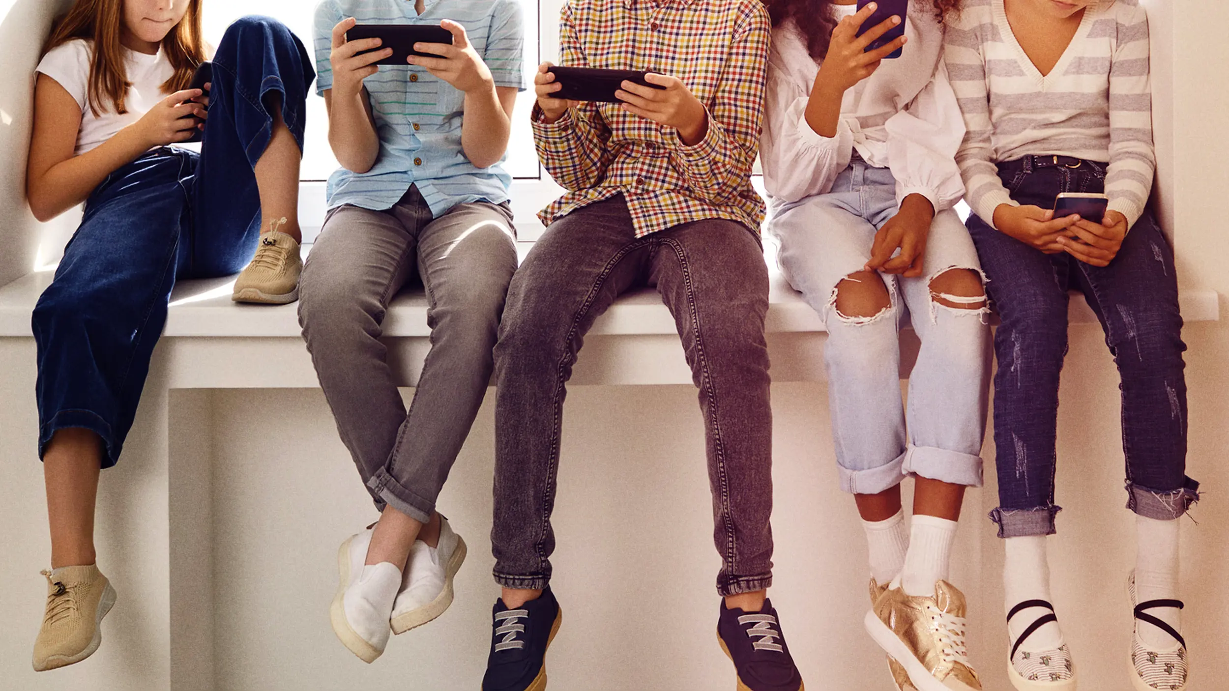 Young people looking at phones