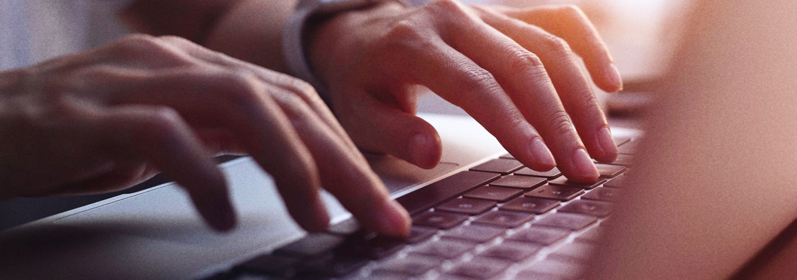 Woman typing on computer