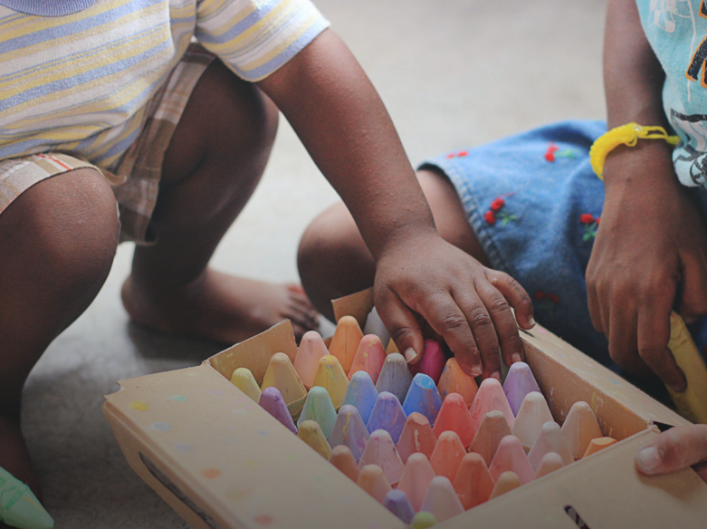 Two children with crayons