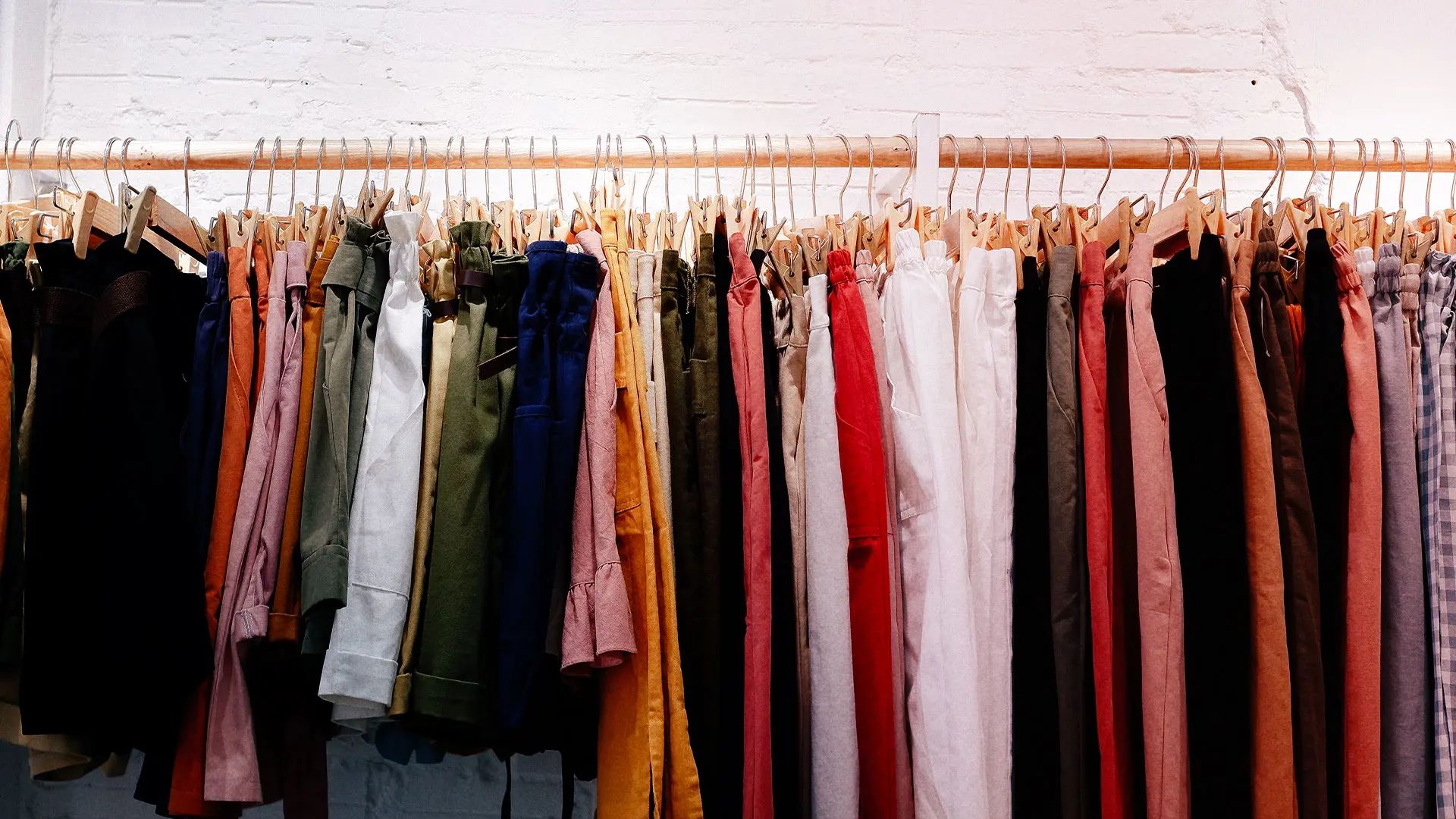 Clothes on hangars on a rail 