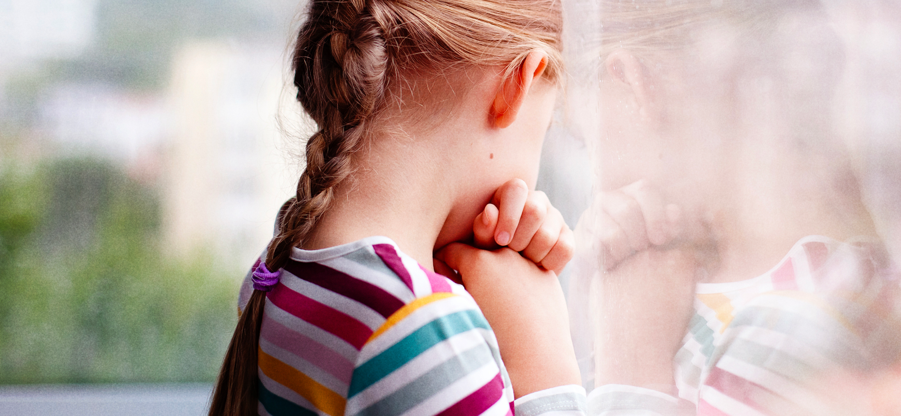 Girl looking out of window