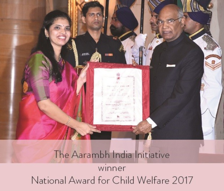 Three people with award