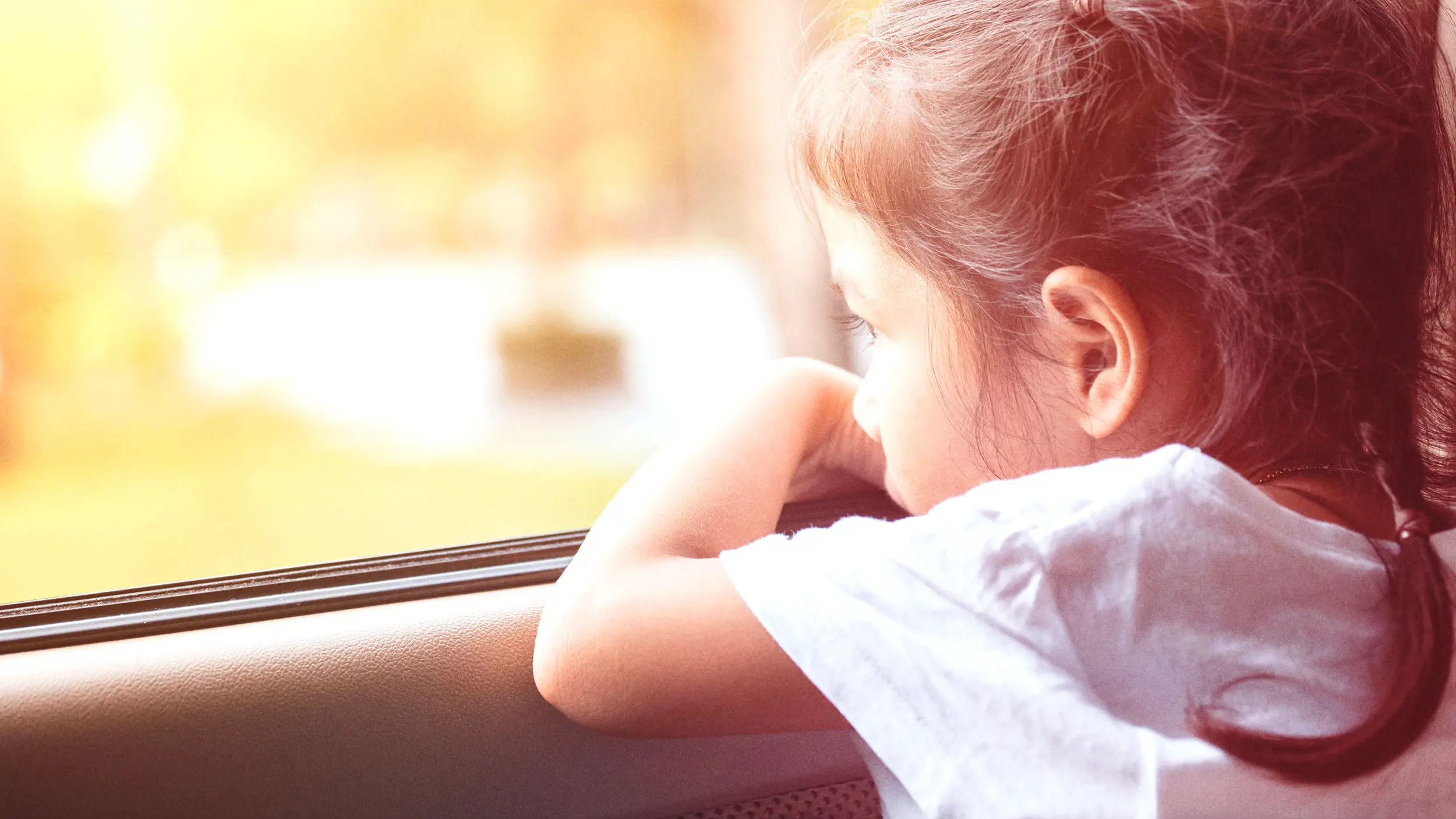 Girl looking out of window