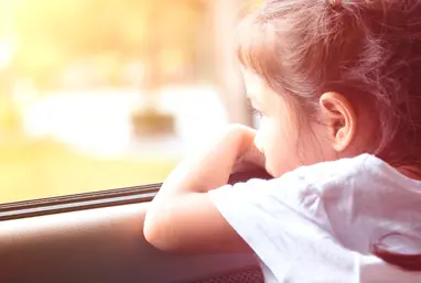 Girl looking out of window