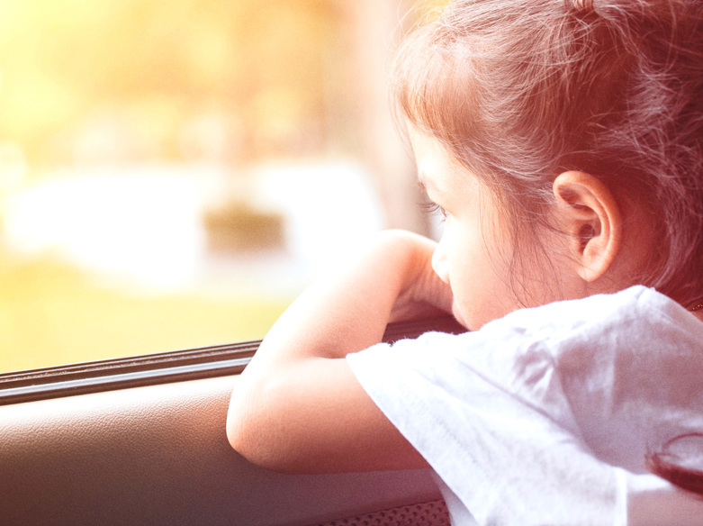 Girl looking out of window