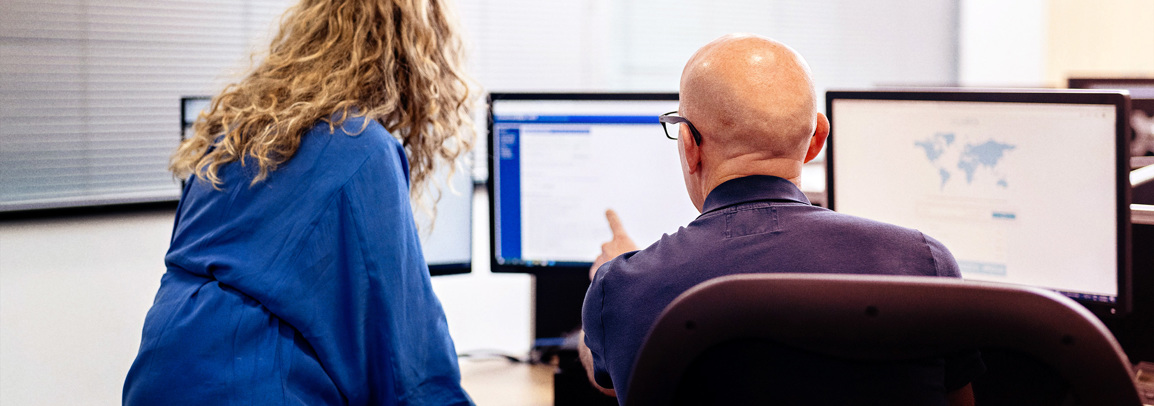 Two people at computer